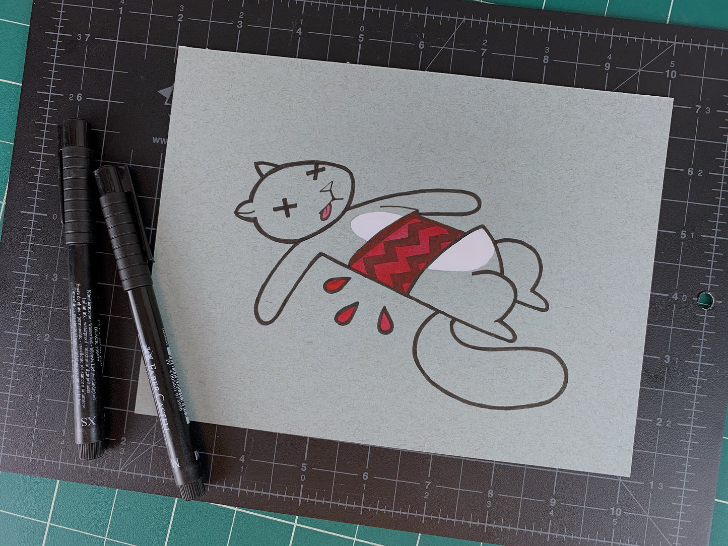 Studio shot of an original illustration of a dead squirrel that has a tire tread mark through it's mid-section. Made using ink, watercolor, and gouache.