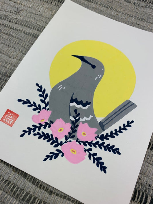Original artwork of the Texas state bird, the northern mocking bird, in front of a geometric circle shape with a cluster of pink evening primrose (Oenothera speciosa), an abundant Texas wildflower.