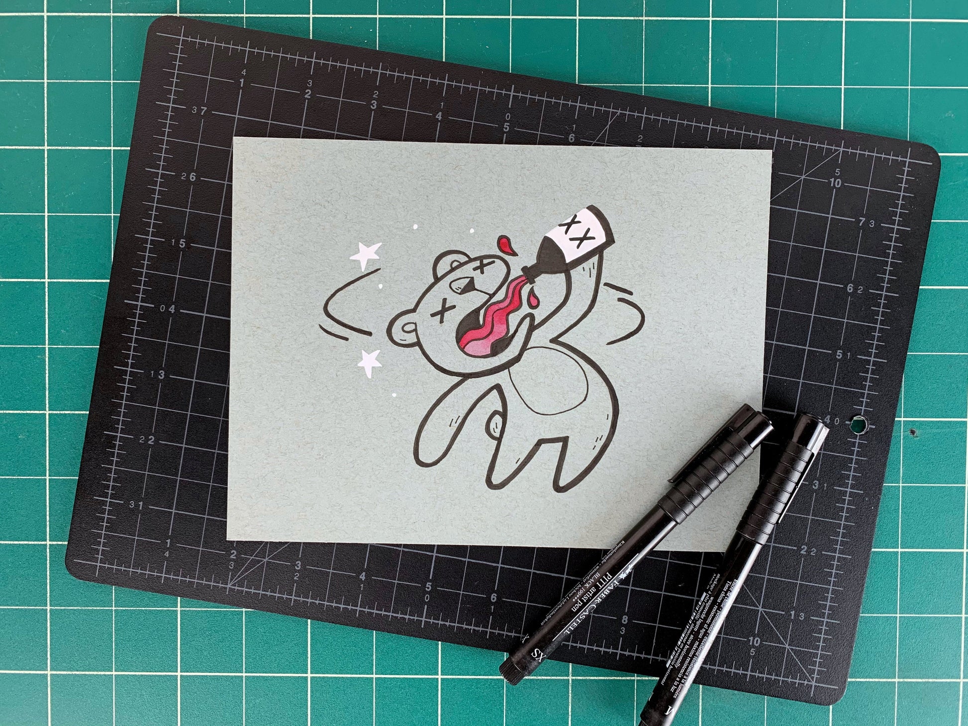 Studio shot of an original illustration of a cute bear getting dizzy and seeing stars while drinking from a bottle with X's on it. Made using ink, watercolor, and gouache.