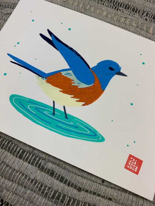 Original artwork of a western blue bird bathing in a small pool of water.