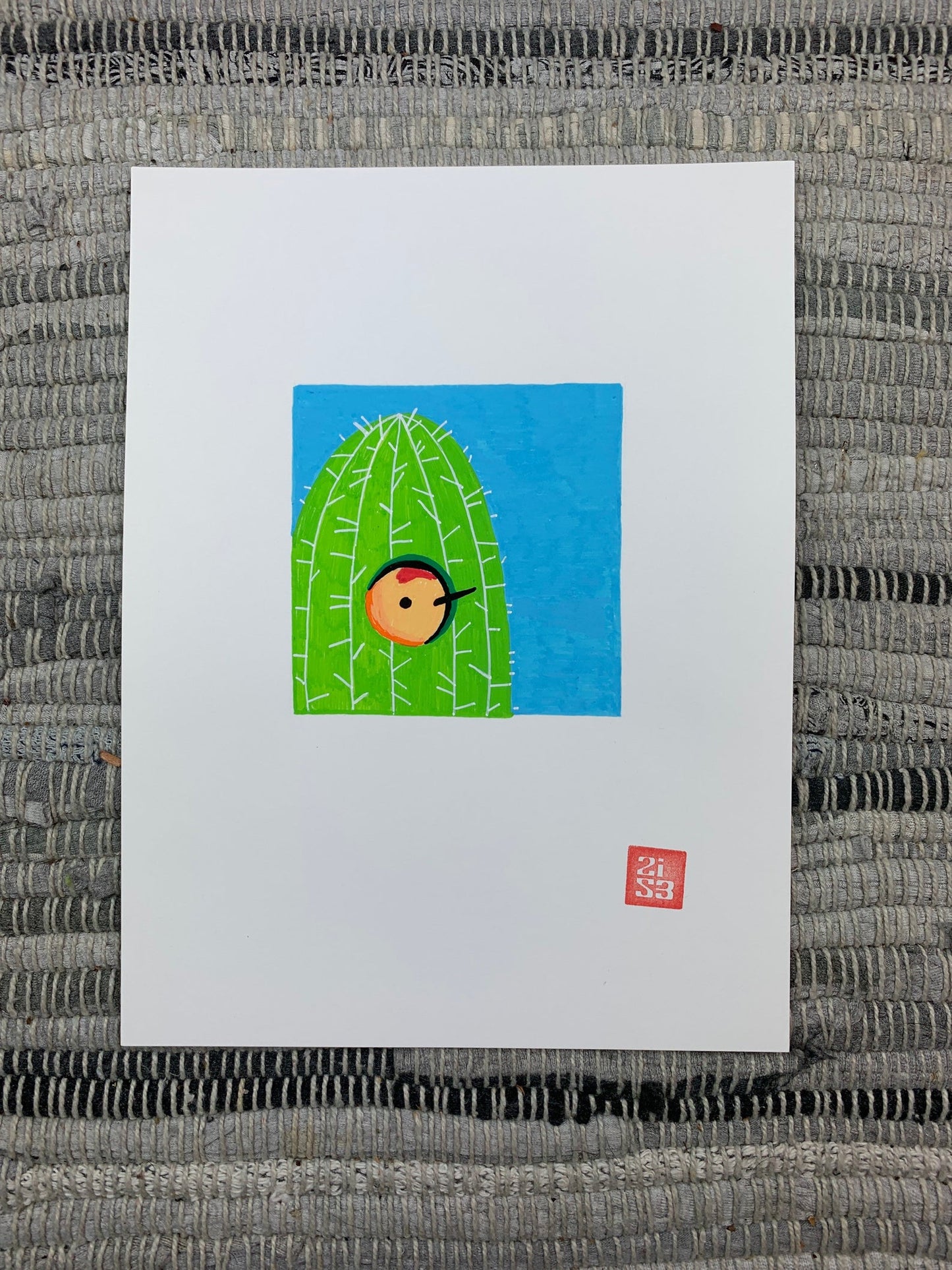 Original artwork of a gila woodpecker poking it's head out of it's saguaro cactus nest.