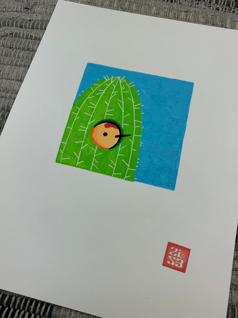 Original artwork of a gila woodpecker poking it's head out of it's saguaro cactus nest.