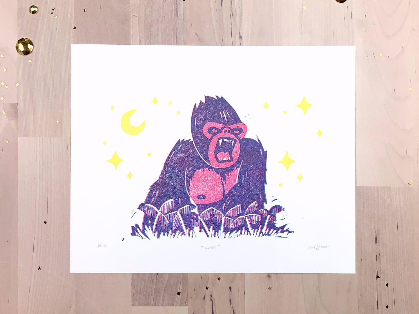 Original limited edition # art print by Amber Orenstein. Two color, pink and turquoise, reduction block print of a King Kong roaring on his jungle island home with yellow stars and moon.
