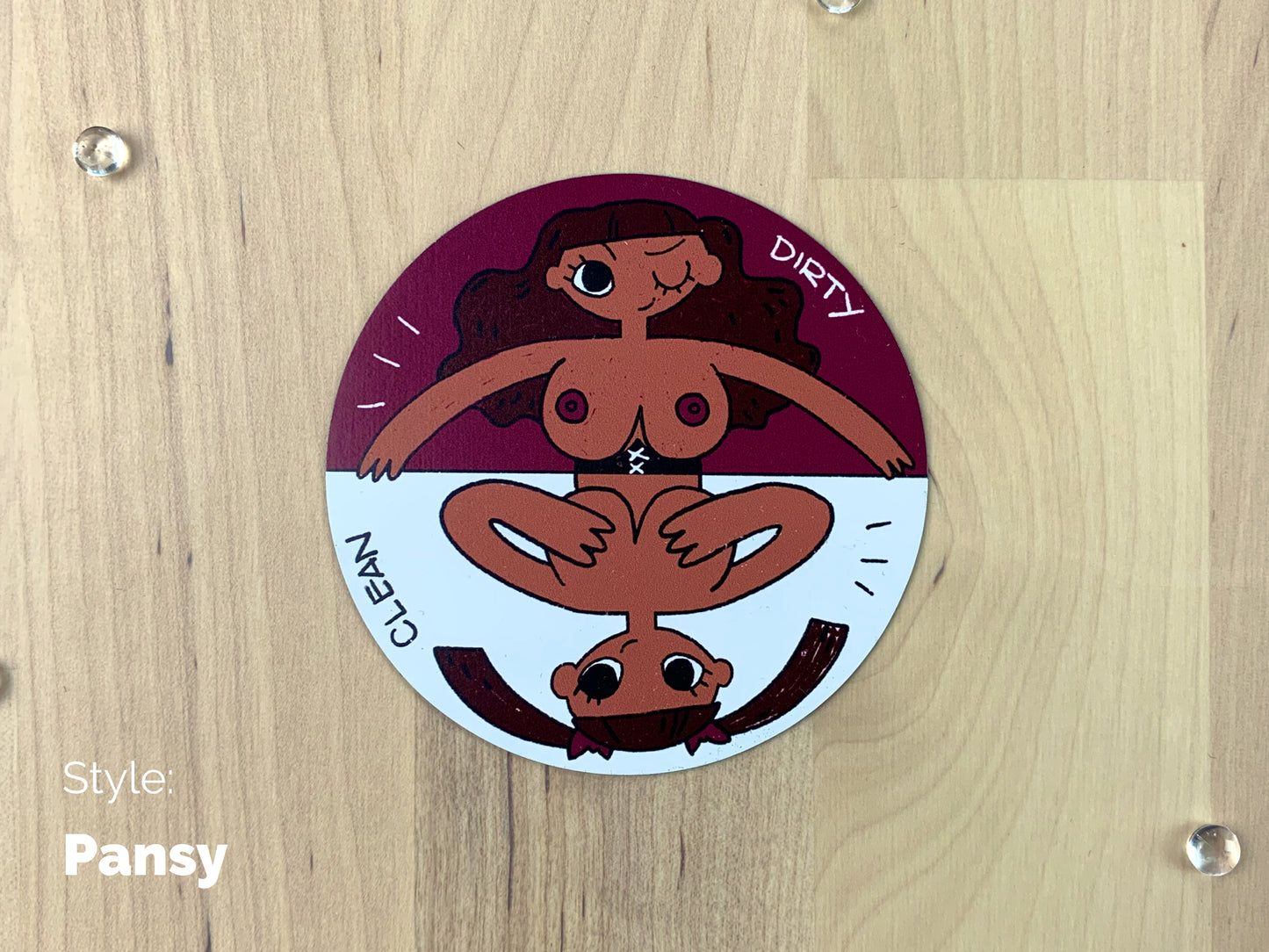 A circular sheet magnet with a sassy illustration of a darker complexion lady with her top off on the dirty half, and covering her boobies on the clean half.