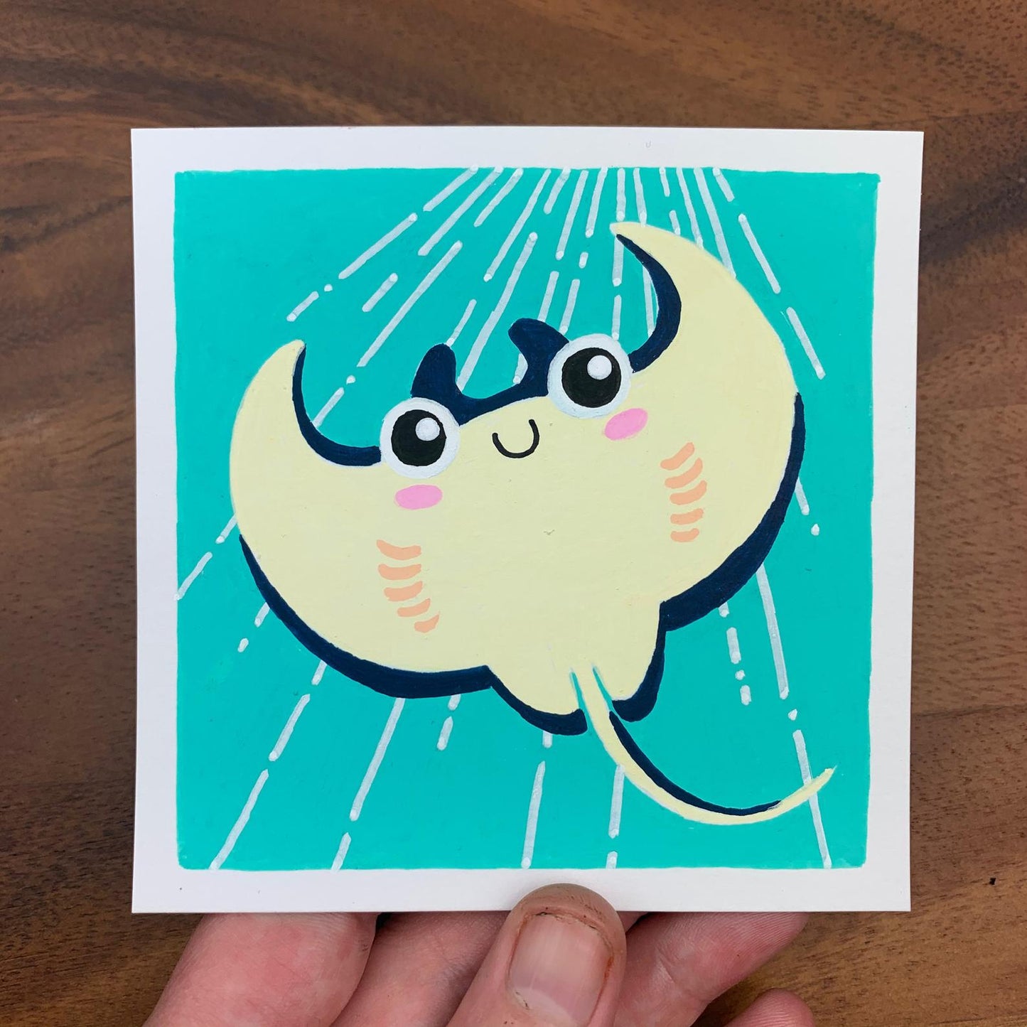 Original artwork of a cute manta ray in a bright blue ocean. Materials used: Uni-Posca paint markers.