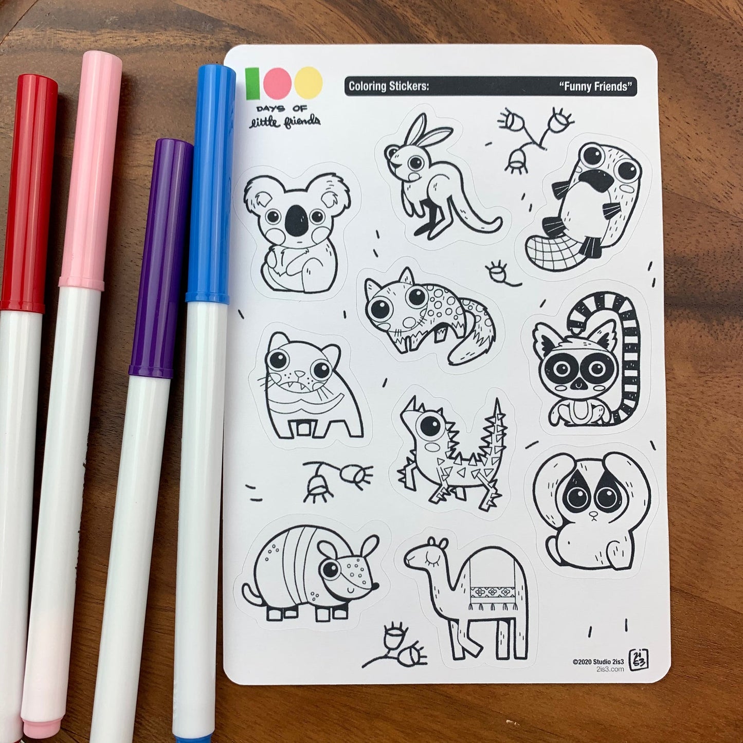Markers and a sticker sheet with 10 little animal stickers on it. A Koala, Kangaroo, Platypus, Quoll, Tasmanian Devil, Thorny Devil, Lemur, Armadillo, Camel, and a Slow Loris.