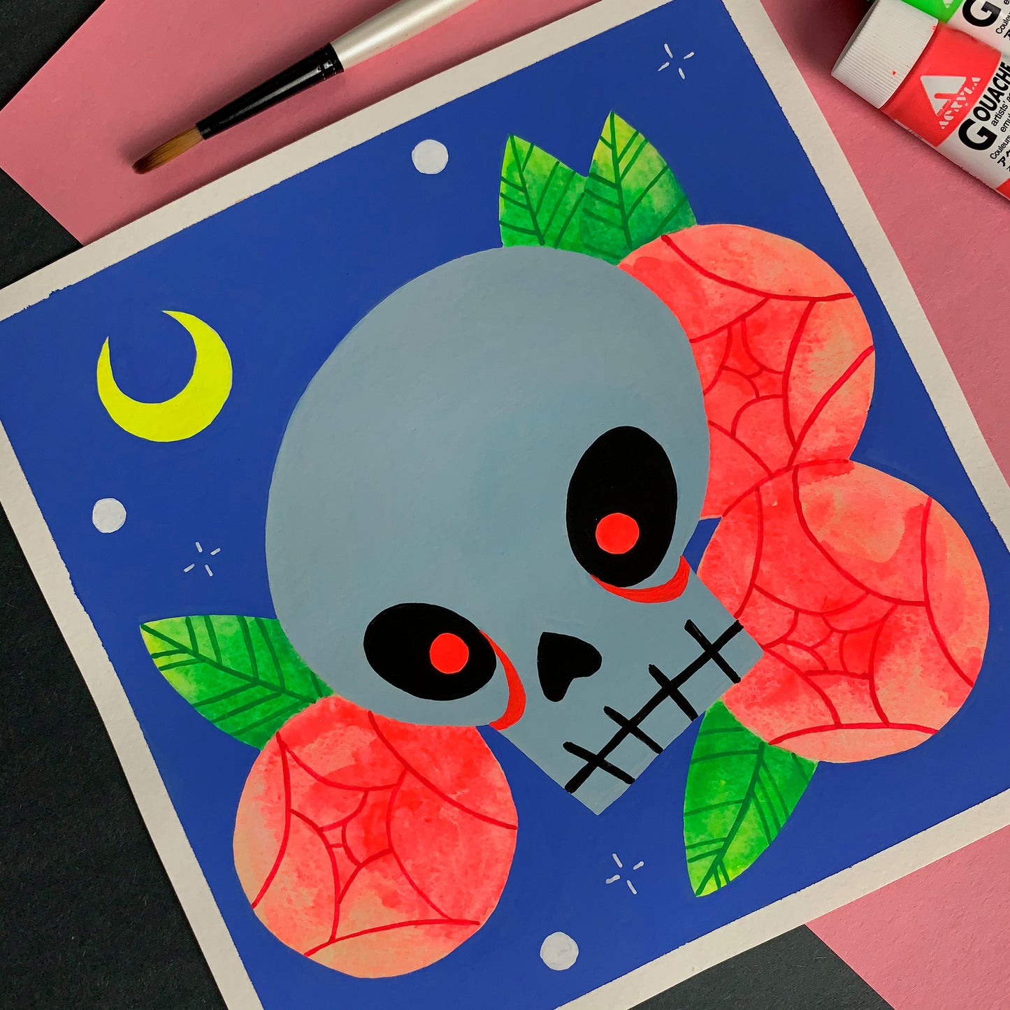 Gouache painting of a skull with glowing red eyes.