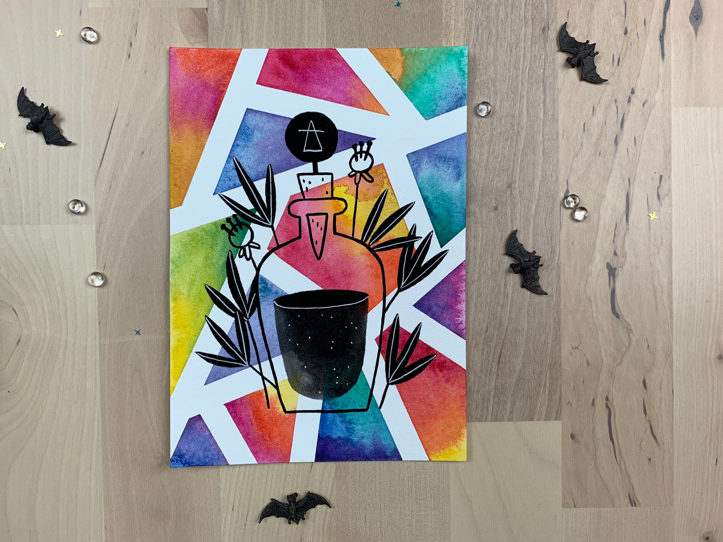 Original artwork depicting a colorful geometric watercolor and gouache painting of a potion bottle.