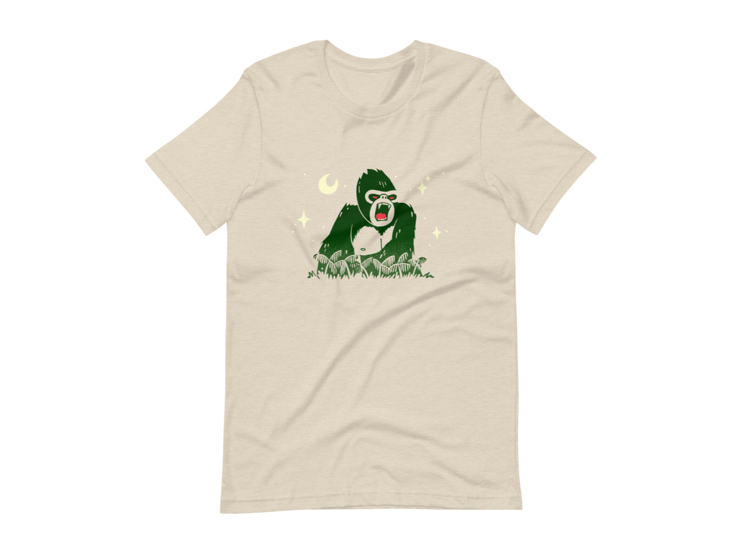 T-shirt with block print style art by Amber Orenstein. Beige shirt with green King Kong, yellow stars, and red eyes/tongue.