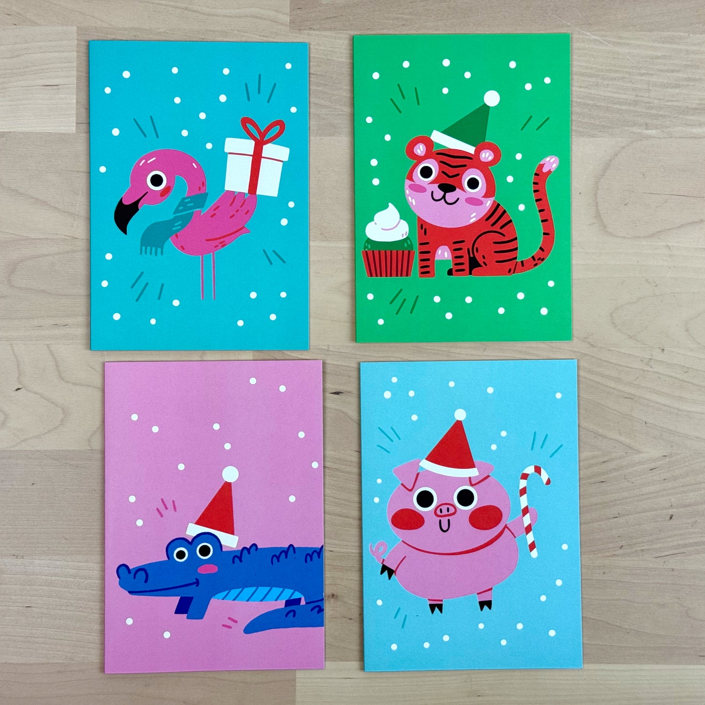 Holiday Party Animals set of four holiday greeting cards with matching reusable gift tags