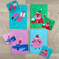 Holiday Party Animals set of four holiday greeting cards with matching reusable gift tags