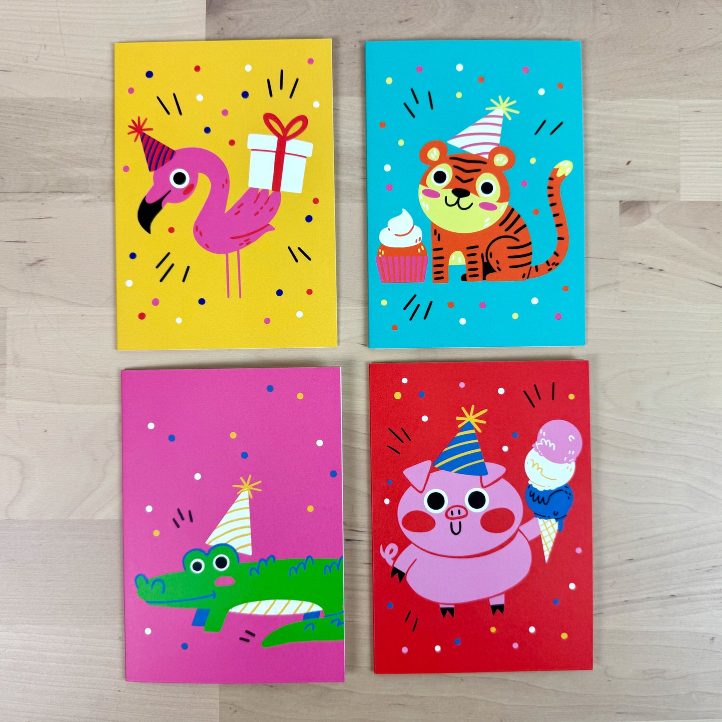 Party Animals set of four birthday greeting cards with matching reusable gift tags