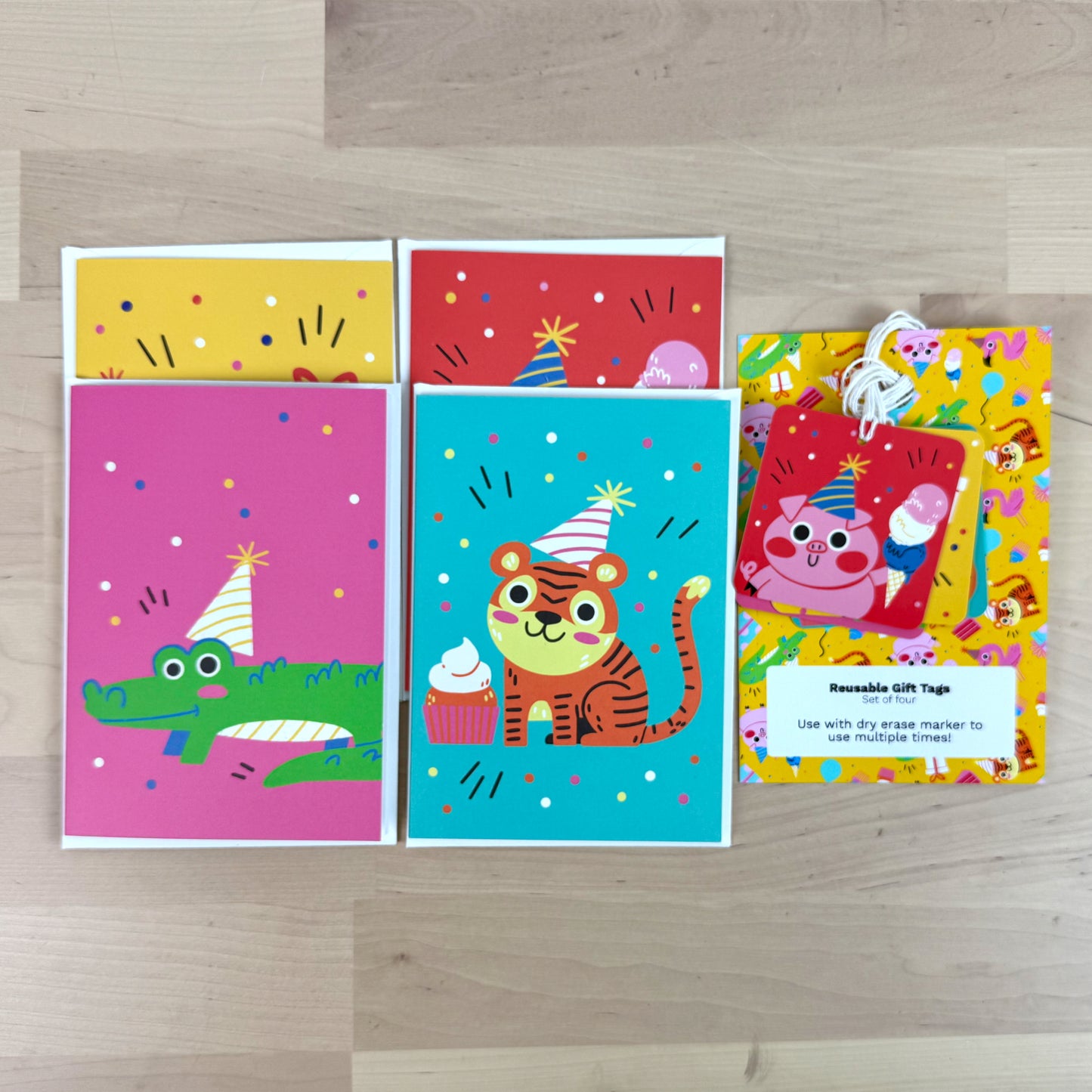 Party Animals set of four birthday greeting cards with matching reusable gift tags