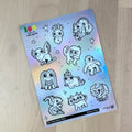 Holographic sticker sheet with cute little monsters you can color