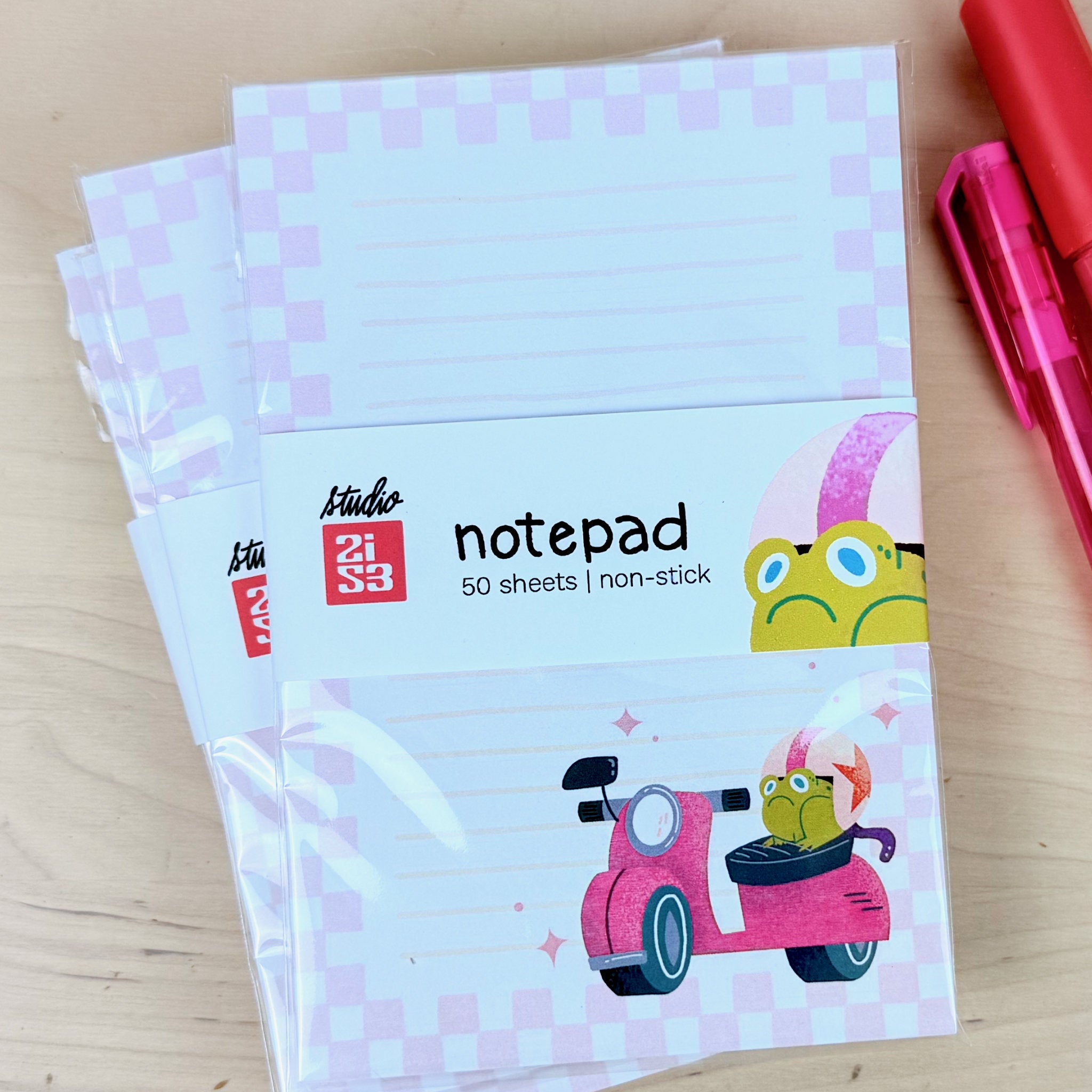 Stack of Jump Start! grumpy frog on a scooter notepads