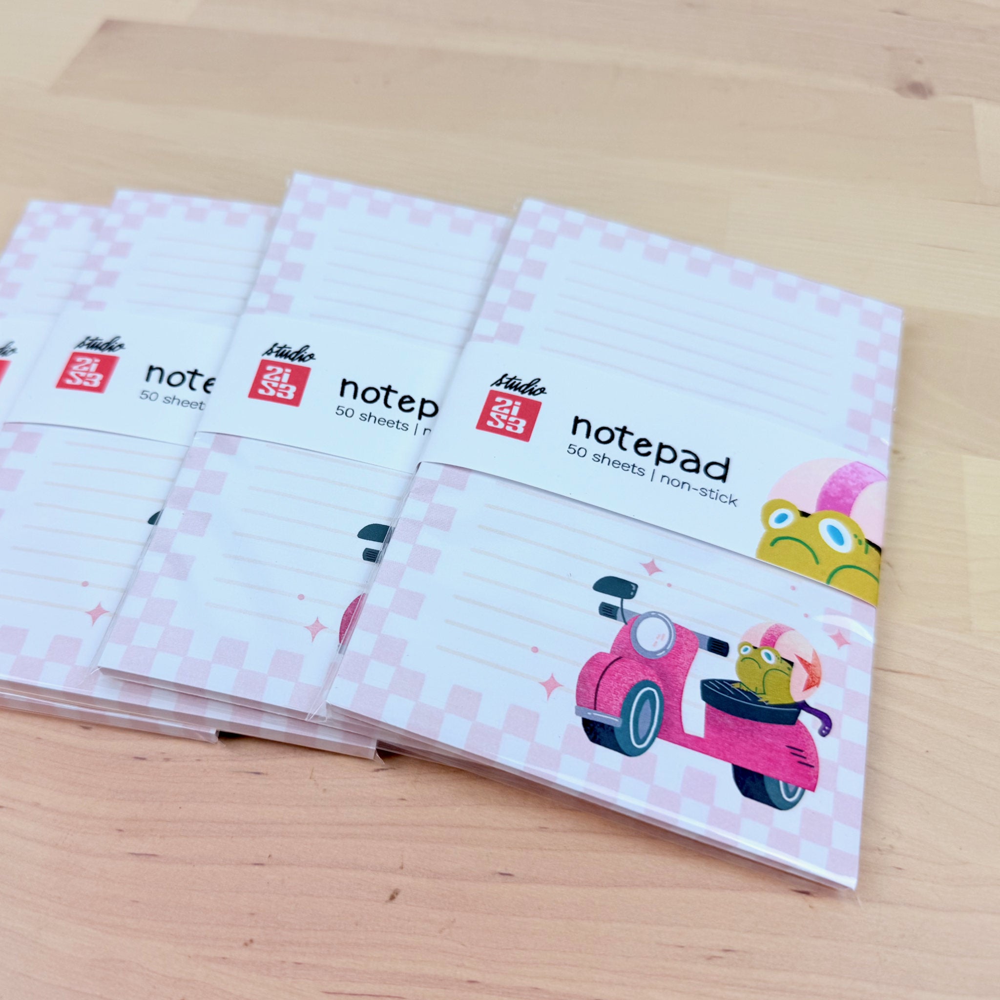 Stack of Jump Start! grumpy frog on a scooter notepads