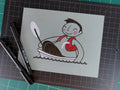 Studio shot of an original illustration of an overweight man that doesn't fit in his lifejacket sitting in a very small boat. Made using ink, watercolor, and gouache.