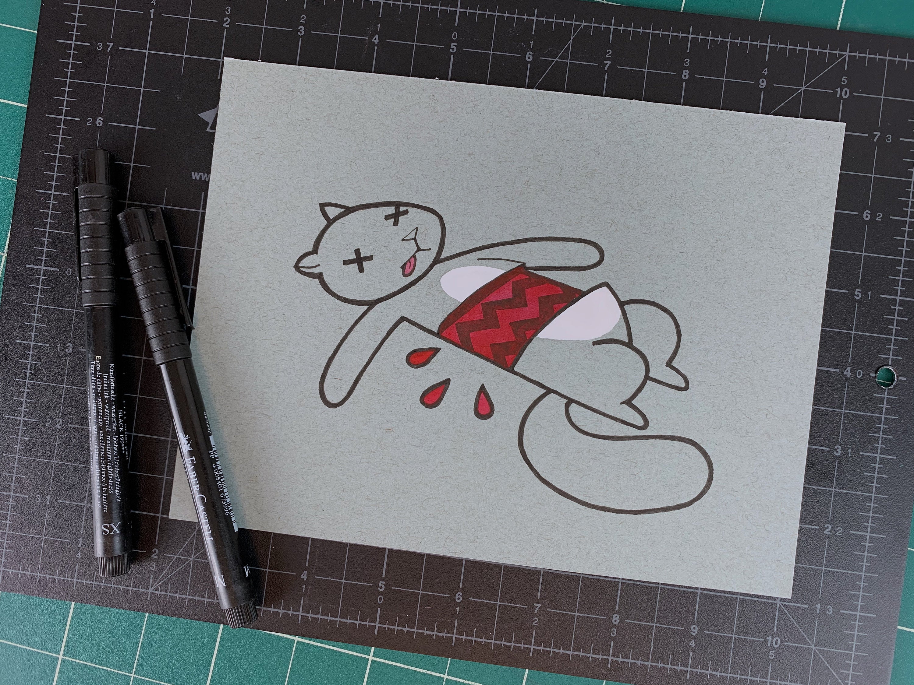 Studio shot of an original illustration of a dead squirrel that has a tire tread mark through it's mid-section. Made using ink, watercolor, and gouache.