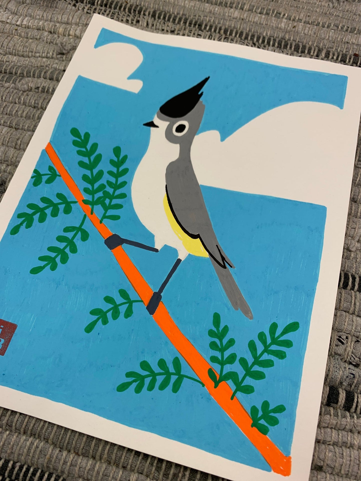 Original artwork of a small grey bird with some yellow highlights under it's wings.