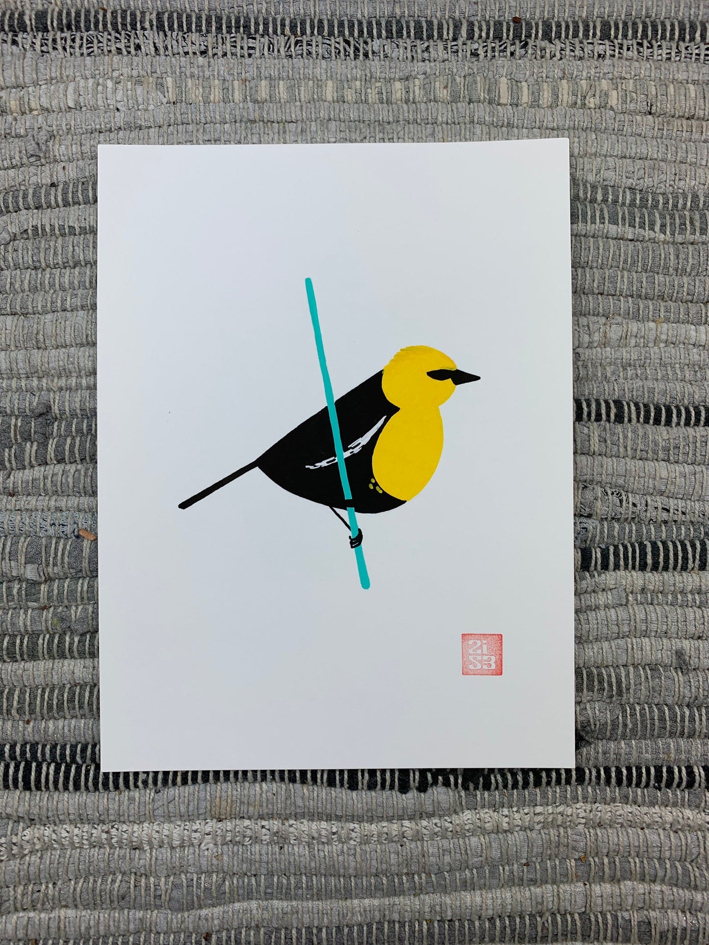 Original artwork of black bird with a bright yellow head standing on a thin wire.