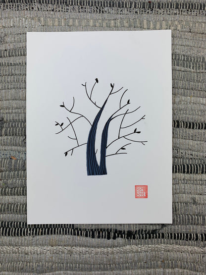 Original artwork of a tree with few leaves on it and a small silhouette of a hummingbird that looks similar to the leaves.