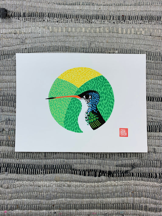 Original artwork of a hummingbird with a textured background framed in a circle.