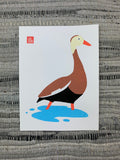Original artwork of a brown duck with a cream colored head, orange beak, and orange legs wades through the shallow water.