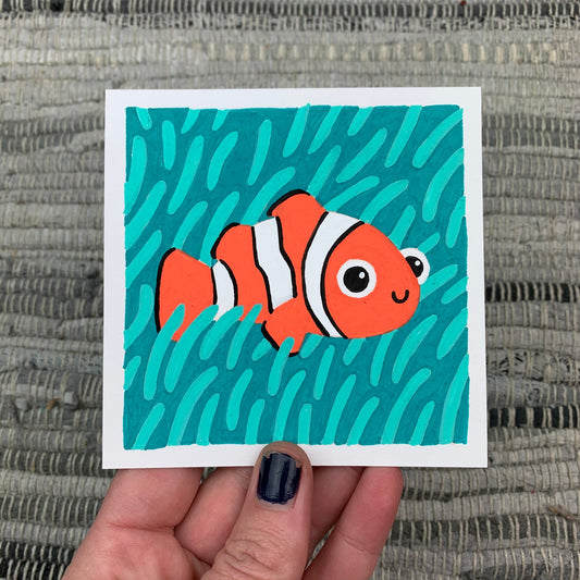Original artwork of a cute clown fish hiding amongst the teal sea anemone. Materials used: Uni-Posca paint markers.
