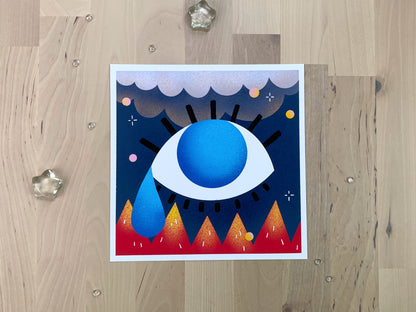 An illustration of a magical all-seeing eye with a teardrop in front of some smokey clouds and fire.