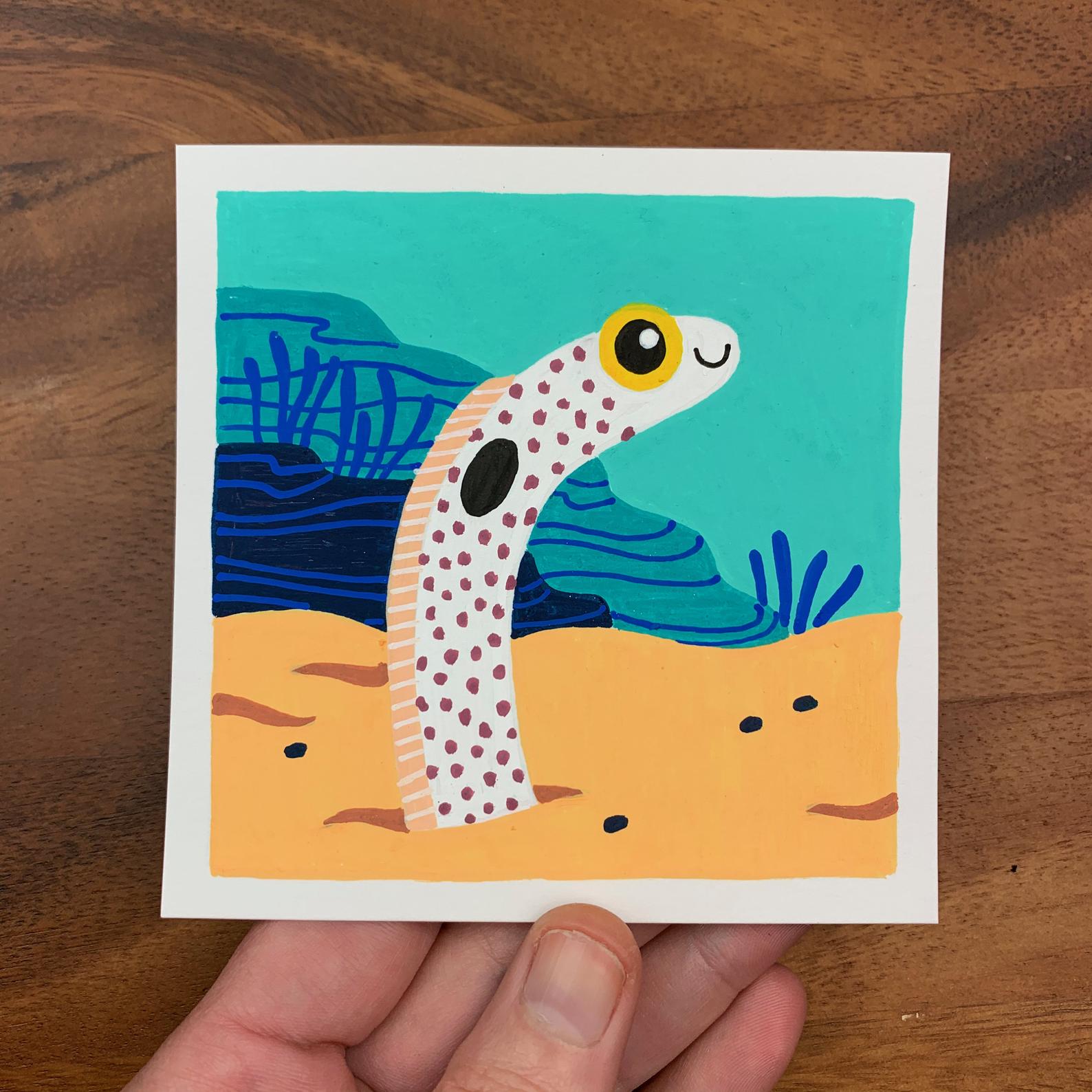 Original artwork of a cute garden eel peeking out of the sandy ocean floor. Materials used: Uni-Posca paint markers.