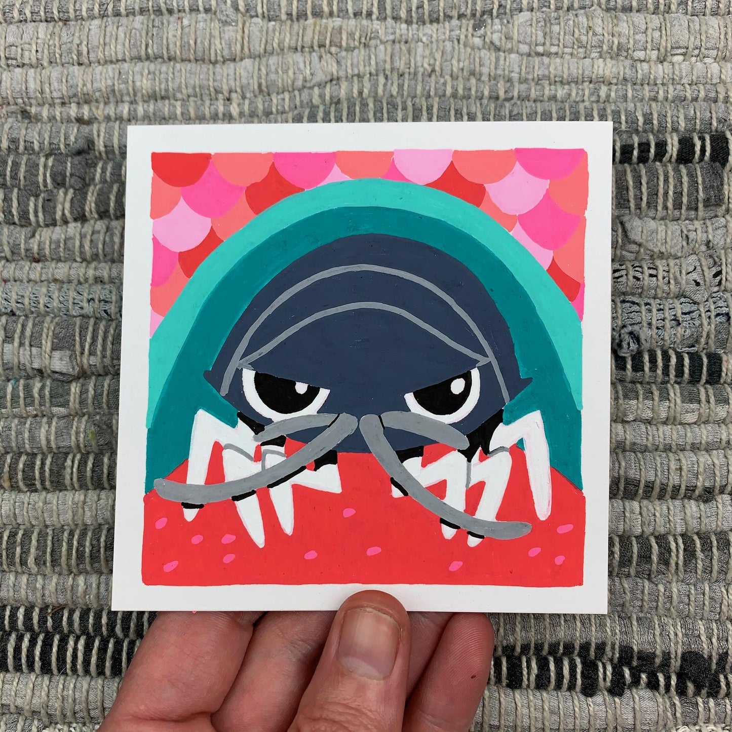 Original artwork of a cute isopd sitting on a fish tongue. Materials used: Uni-Posca paint markers.