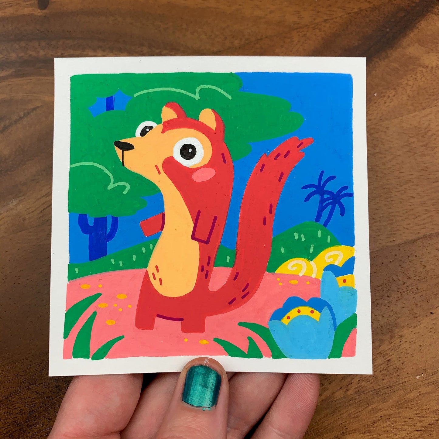 Original artwork of a cute red mongoose in a lush colorful garden. Materials used: Uni-Posca paint markers.