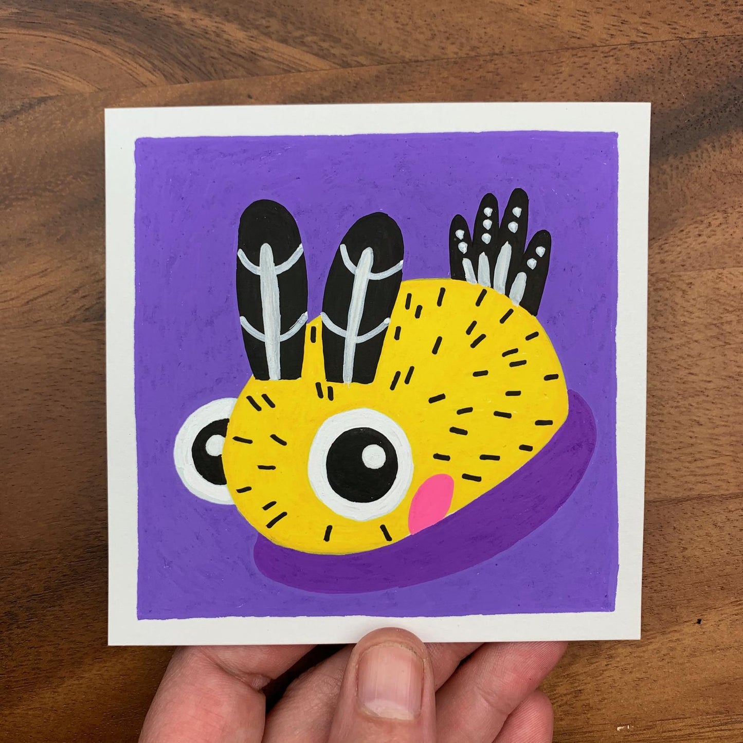 Original artwork of a cute little yellow and black polka dotted sea bunny, or Jorunna Parva. Materials used: Uni-Posca paint markers.