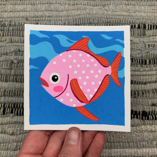 Original artwork of a polka dot pink opah fish swimming in the deep blue ocean. Materials used: Uni-Posca paint markers.