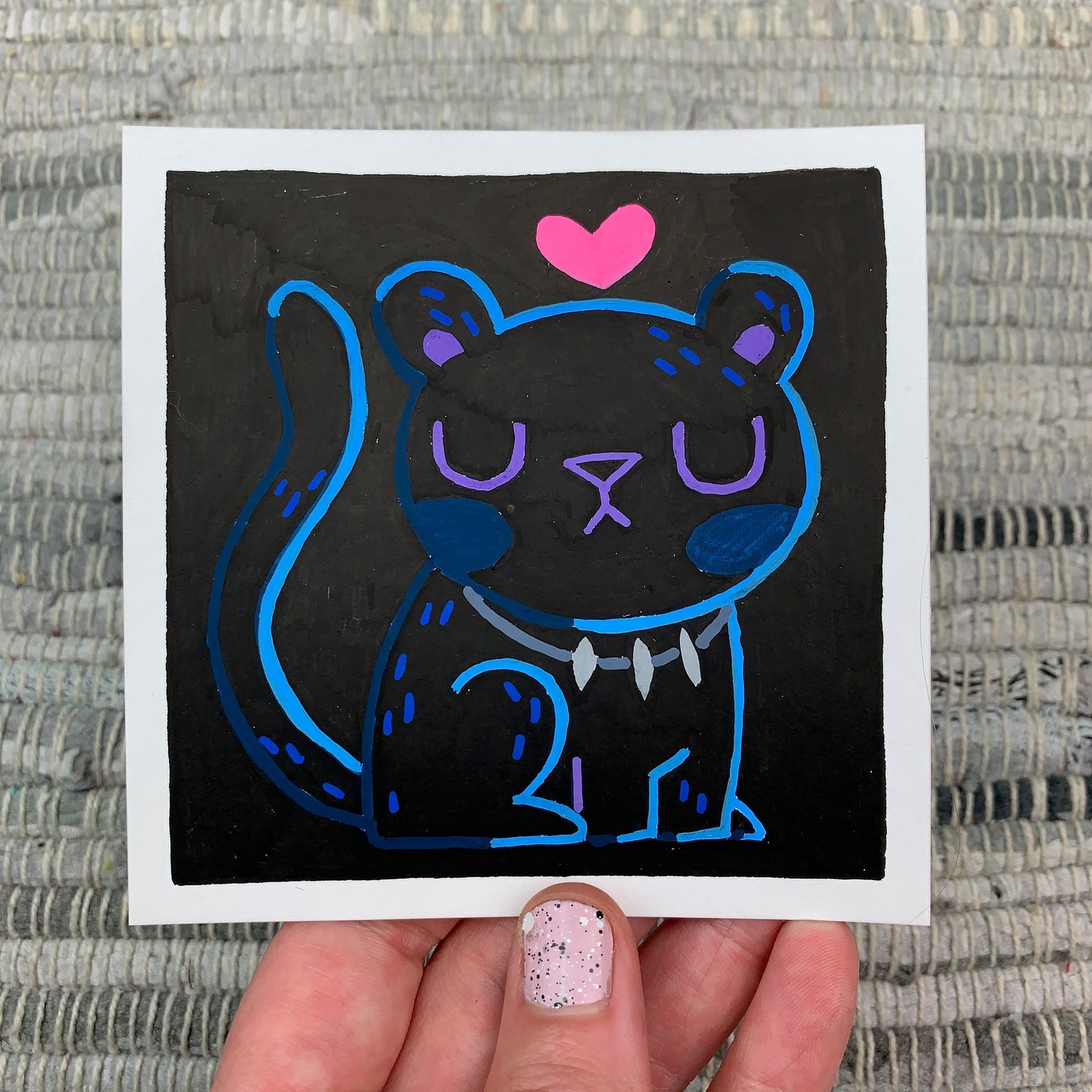 Original artwork of a cute black panther with a heart above it's head. Materials used: Uni-Posca paint markers.