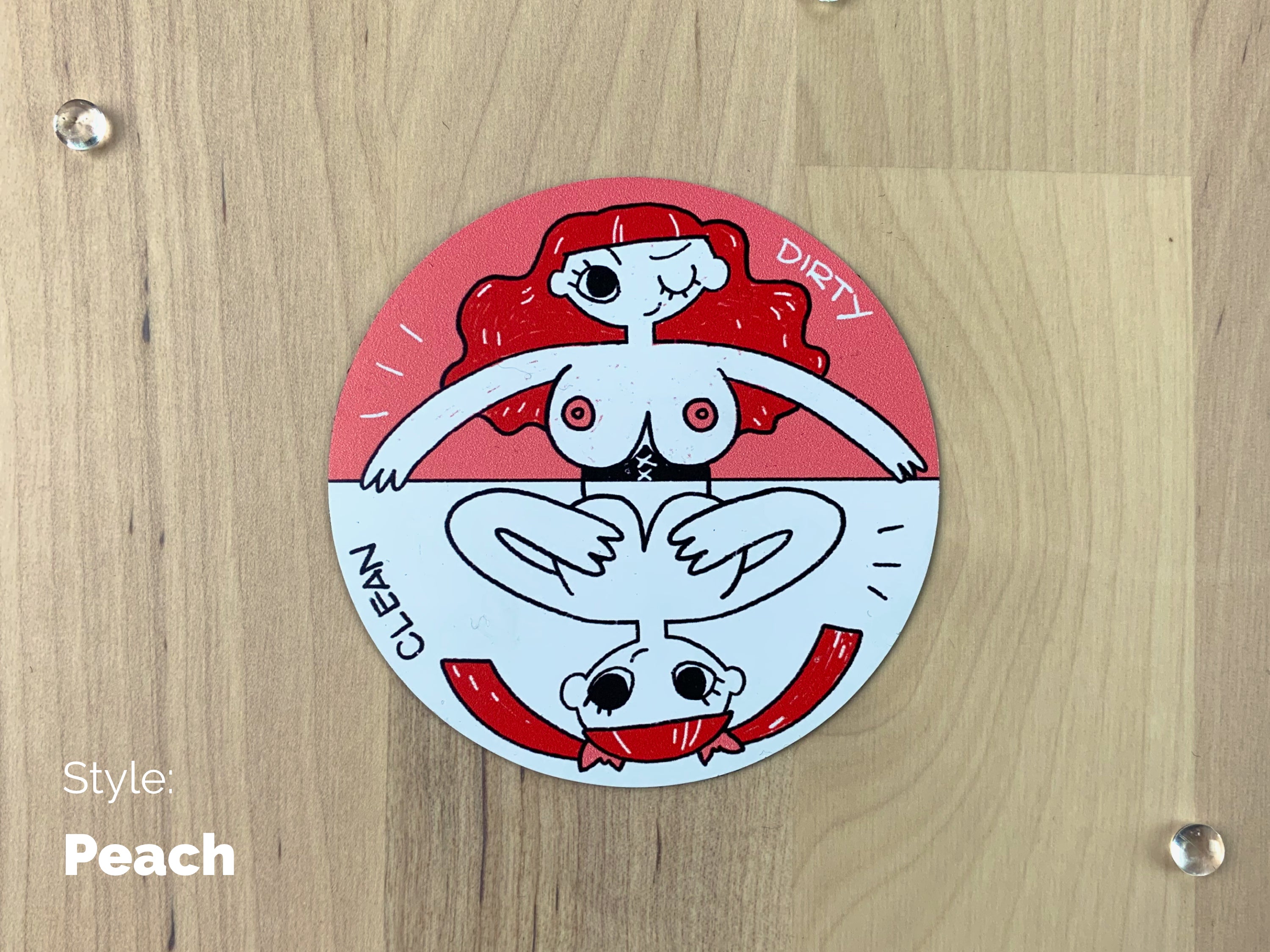 A circular sheet magnet with a sassy illustration of a redhead lady with her top off on the dirty half, and covering her boobies on the clean half.
