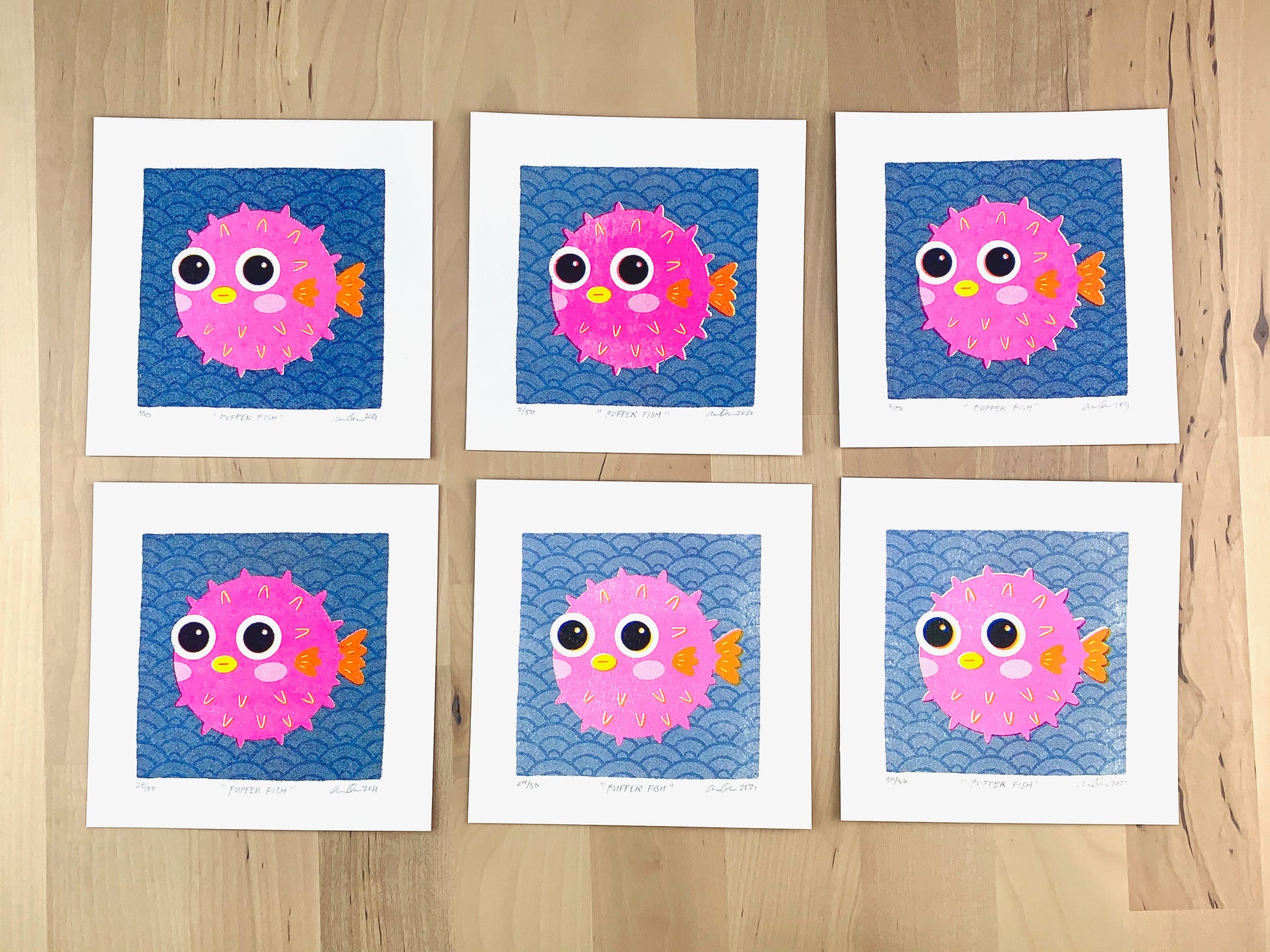 Six Risograph prints of a cute pink pufferfish illustration on a wave pattern background showing the unique variations.