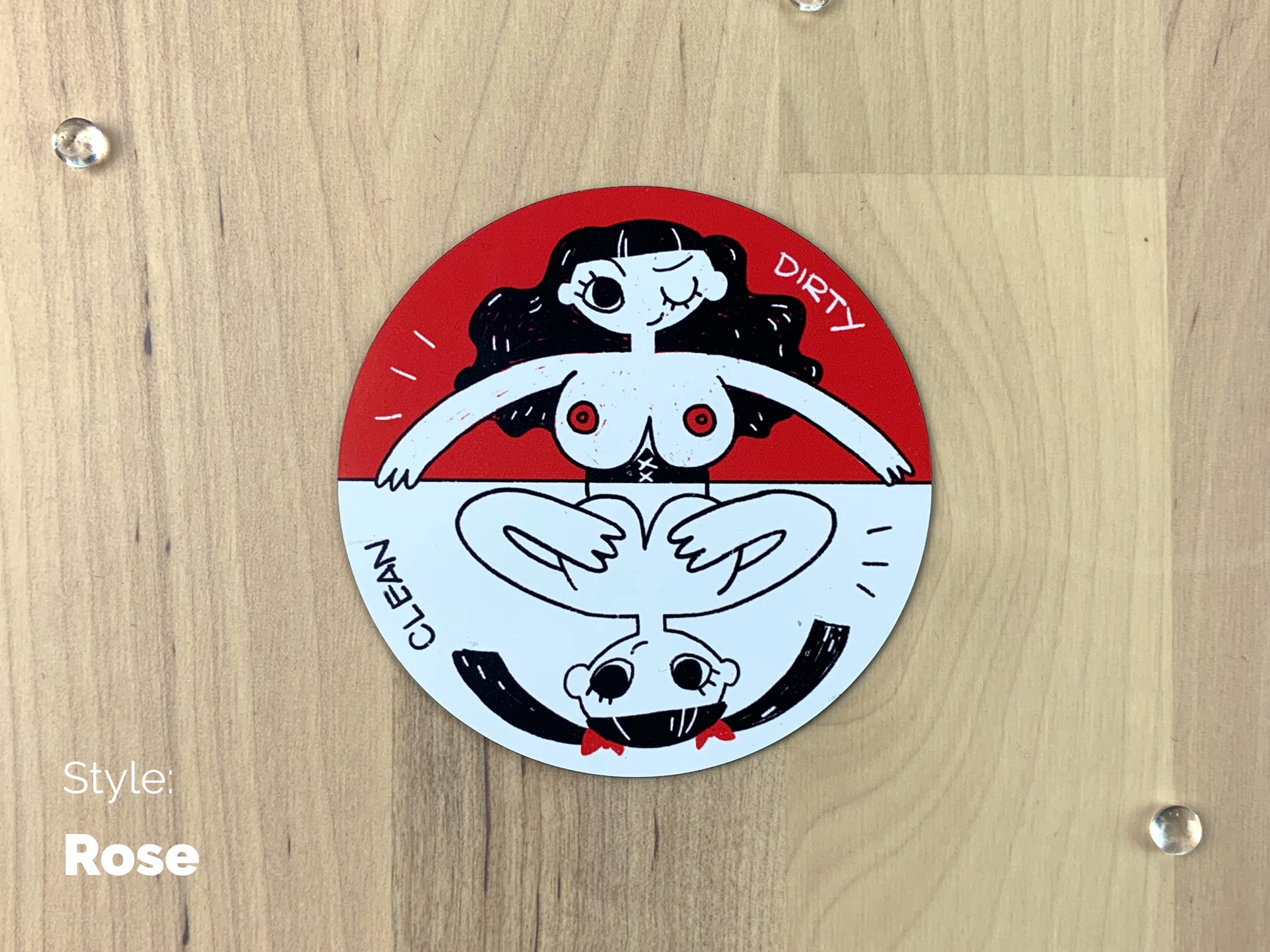 A circular sheet magnet with a sassy illustration of a lady with her top off on the dirty half, and covering her boobies on the bottom half.