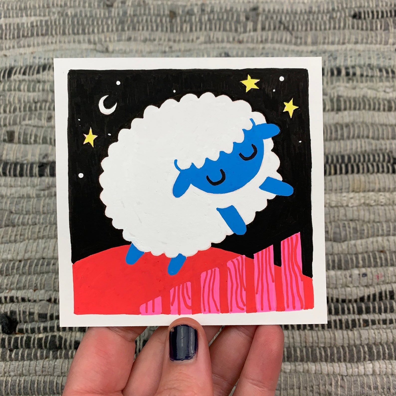 Original artwork of a cute sheep jumping over a fence at night. Materials used: Uni-Posca paint markers.