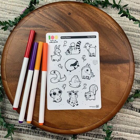 Markers and a sticker sheet with 10 little animal stickers on it. A Llama, Raccoon, Goat, Sheep, Snake, Chicken, Horse, Pig, Cow, and Skunk.