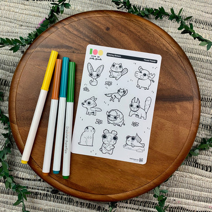 Markers and a sticker sheet with 10 little animal stickers on it. A Fox, Beaver, Moose, Wolf, Coyote, Bison, Squirrel, Prairie Dog, Bear, and Mudskipper.