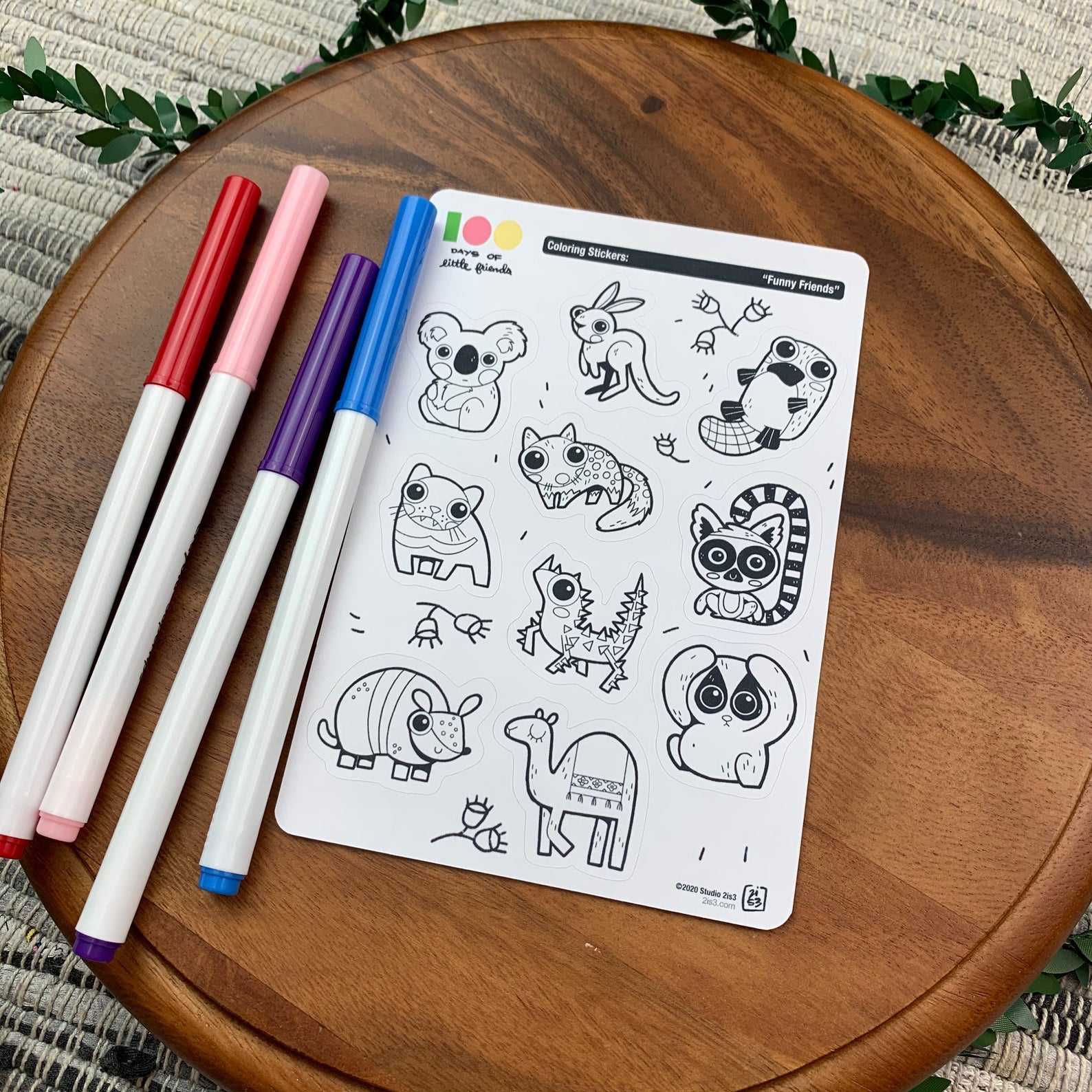 Markers and a sticker sheet with 10 little animal stickers on it. A Koala, Kangaroo, Platypus, Quoll, Tasmanian Devil, Thorny Devil, Lemur, Armadillo, Camel, and a Slow Loris.
