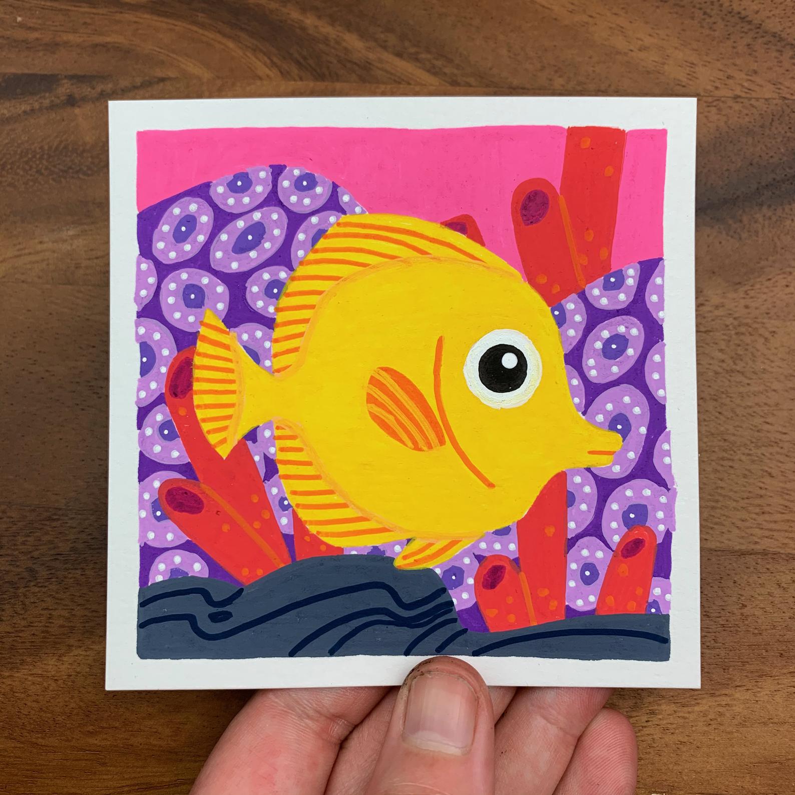 Original artwork of a cute yellow tang fish swimming around the reef. Materials used: Uni-Posca paint markers.