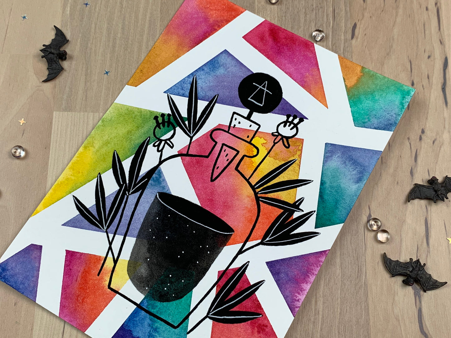 Original artwork depicting a colorful geometric watercolor and gouache painting of a potion bottle.