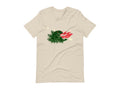 T-shirt with block print style art by Amber Orenstein. Beige shirt with a green godzilla, yellow stars, and red flames coming from his mouth.